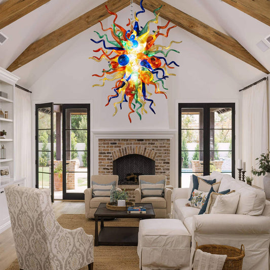 A modern living room interior designed with a vibrant multi-color blown art glass chandelier as the stunning centerpiece.
