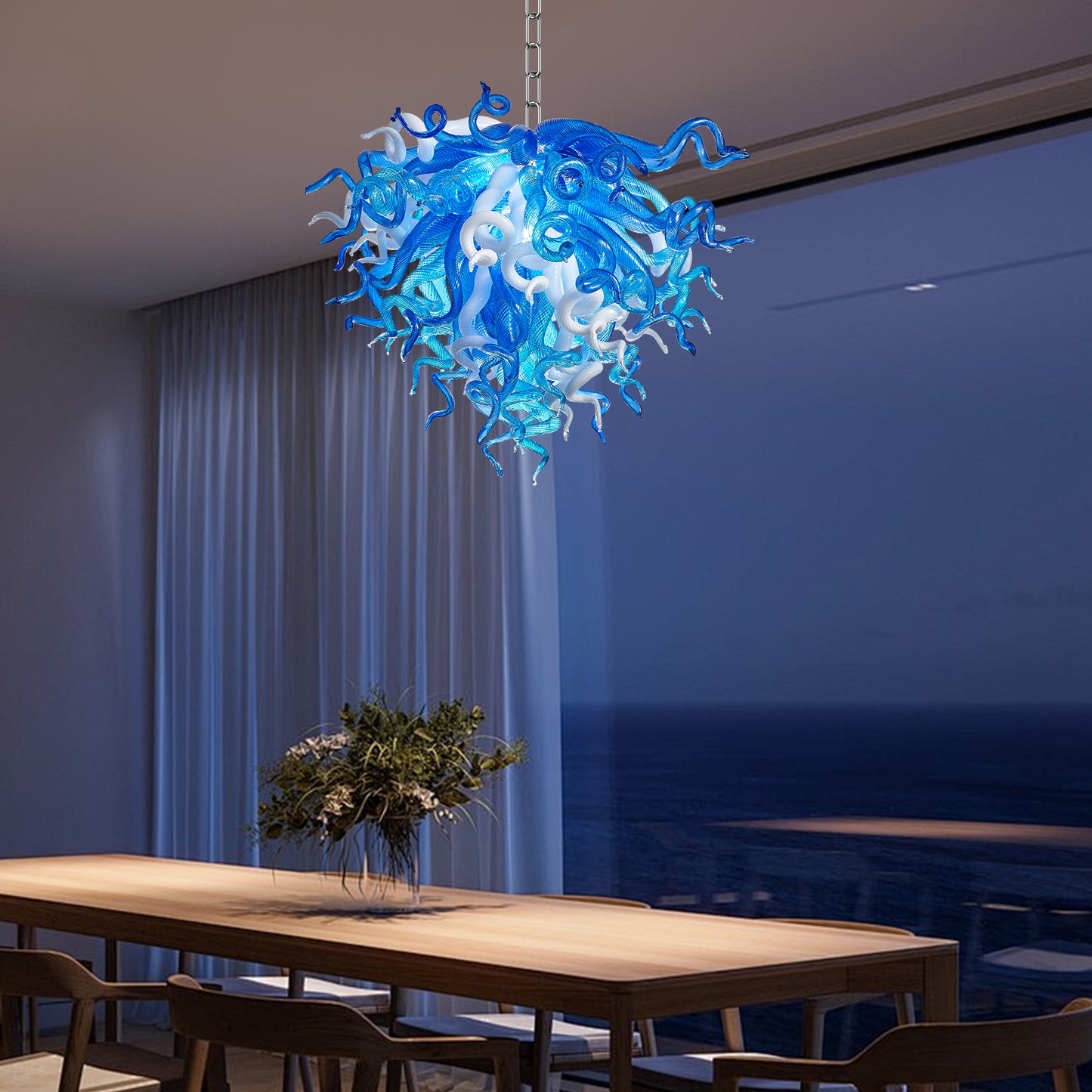 Chihuly-inspired murano blown art glass chandelier in waterfront dining room.
