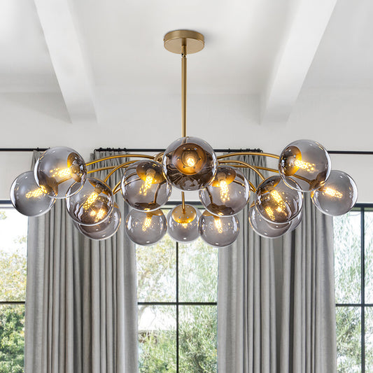 Industrial chic smoky gray glass globe chandelier with 16 lights for high-ceiling foyers.