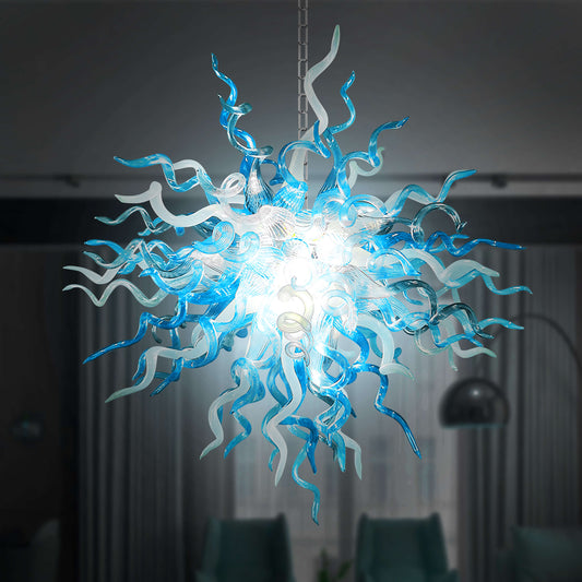 Chihuly chandelier with blue and white blown glass design in a dark room