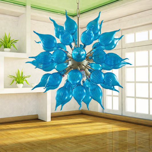 Blue glass chandelier in a room with wooden floor and white walls