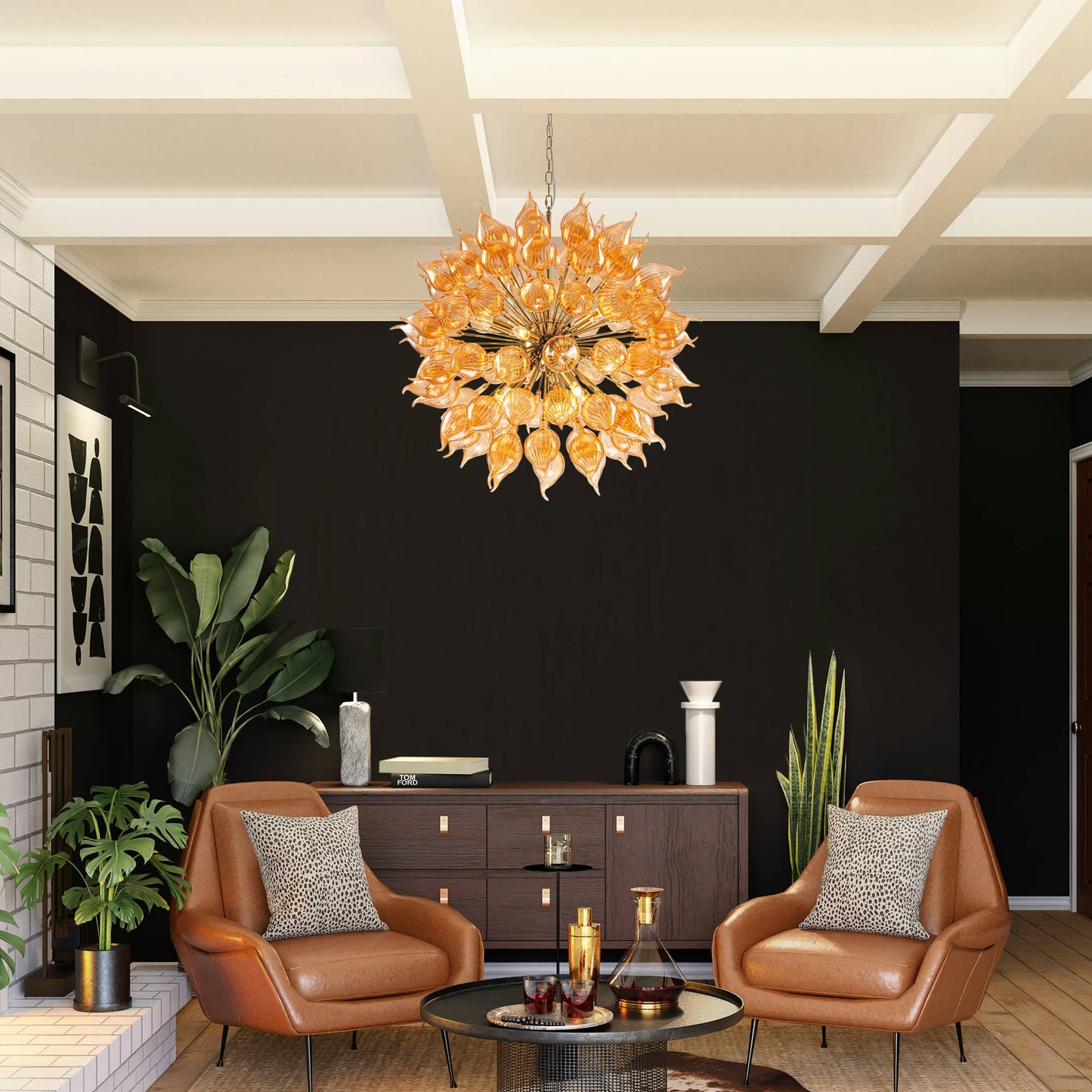 Modern living room with a blown glass chandelier, brown leather chairs, and decorative items.