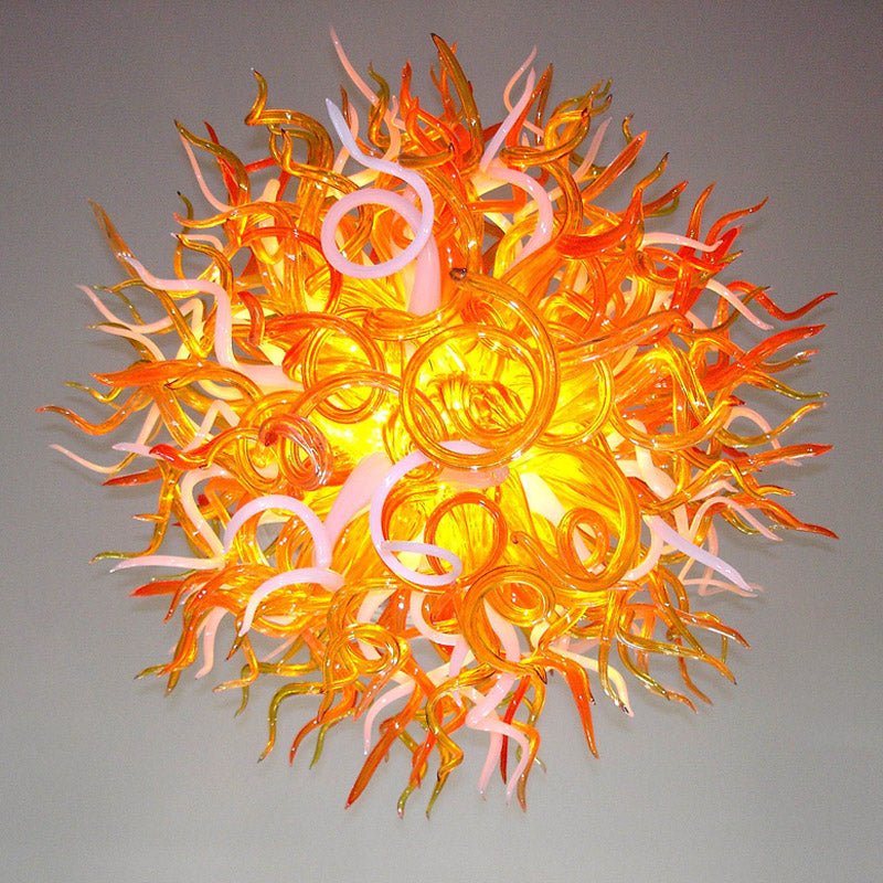 Detailed sculptural view of the orange and white glass tendrils, highlighting the fiery organic flow of the artisan lighting fixture.