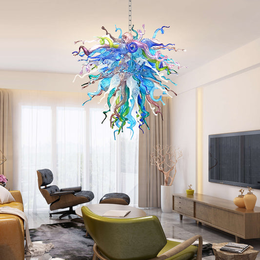 Colorful Chihuly style chandelier in a modern living room with furniture and decor.