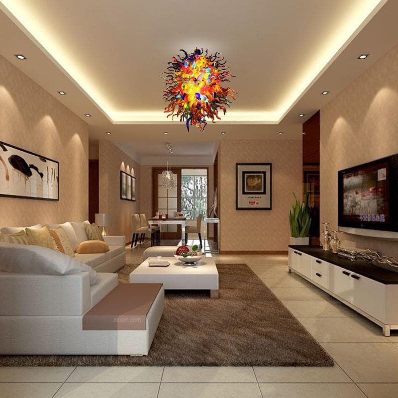 Modern luxury living room with a beige sofa set and elegant decor centered by a vibrant multi-color artisan chandelier.