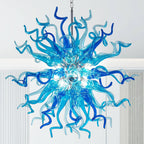 Close-up of a stunning Sputnik chandelier featuring intricately textured, hand-blown blue and azure glass tentacles radiating from a central point.
