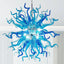 Close-up of a stunning Sputnik chandelier featuring intricately textured, hand-blown blue and azure glass tentacles radiating from a central point.