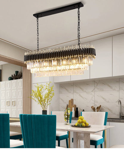 Luxury modern oval chandelier with matte black frame and tiered crystal pendants.