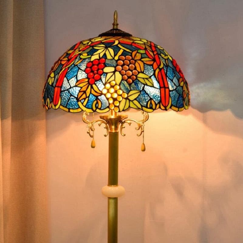 Vintage stained glass standing lamp with blue and red fruit design