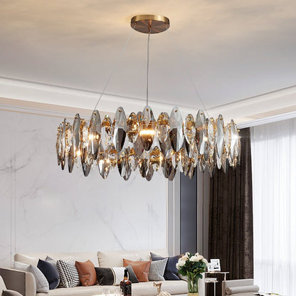 Contemporary round crystal pendant light for elegant home decor and high-end interiors.