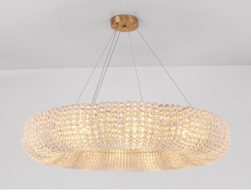 Large modern round crystal chandelier with gold iron frame and dimmable light.