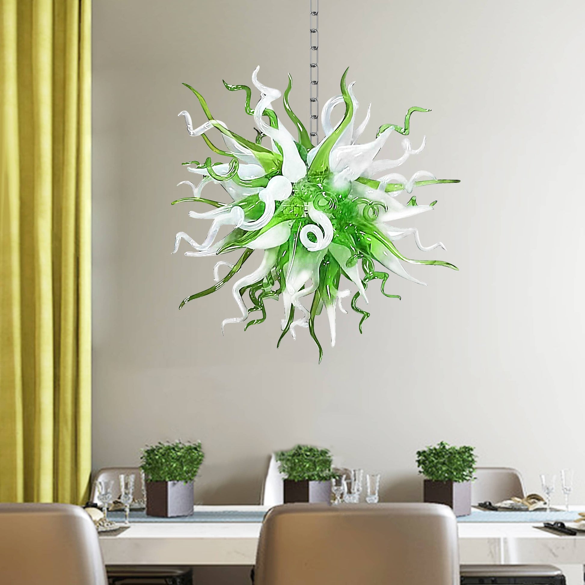 Modern green and white glass art chandelier providing a fresh accent in a bright dining room with neutral decor.