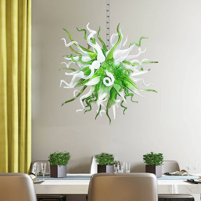 Modern green and white glass art chandelier providing a fresh accent in a bright dining room with neutral decor.