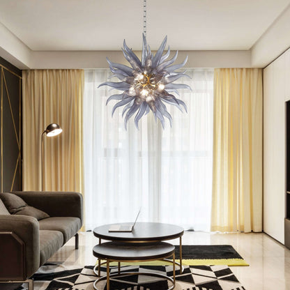 Modern grey glass starburst pendant light installed in a contemporary living room with neutral tones and minimalist furniture.