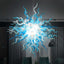 Large spherical hand-blown glass chandelier featuring an intricate web of cyan blue and translucent white glass tendrils against a dark background.