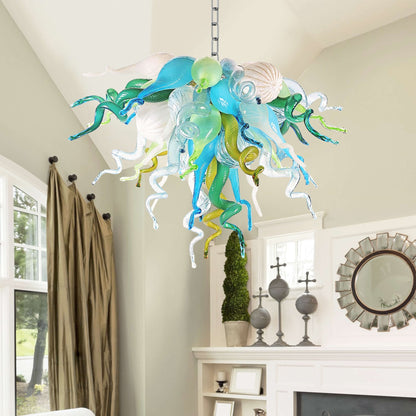 Elegant interior hallway showcasing the cool-toned blue and green glass sculpture light suspended from a high ceiling.