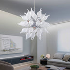 Symmetrical view of the white starburst chandelier in a contemporary urban loft with grey minimalist walls.