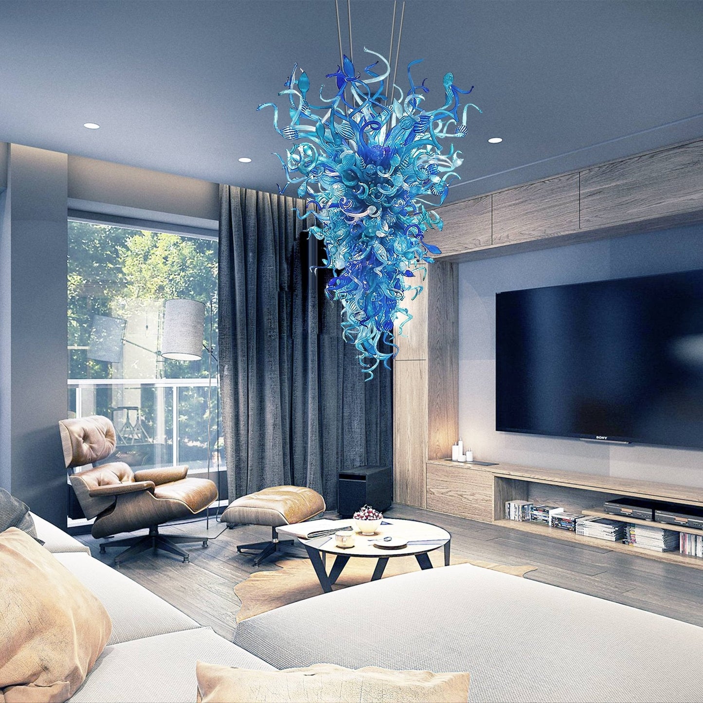 Luxury contemporary living room decor featuring a bespoke blue glass art installation lighting.