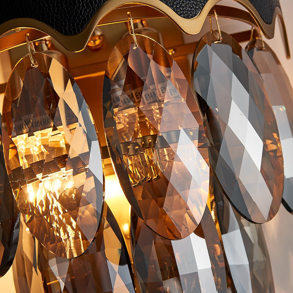 High-quality faceted crystal droplets on gold-plated metal wall light fixture.