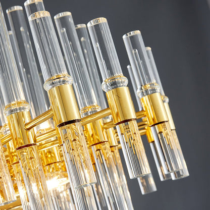 Close-up of high-quality luxury crystal glass rods on a gold stainless steel chandelier frame.