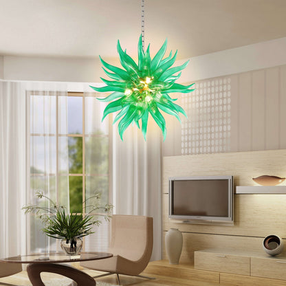 Veridian green glass chandelier creating a warm and inviting atmosphere in a sophisticated lounge area.