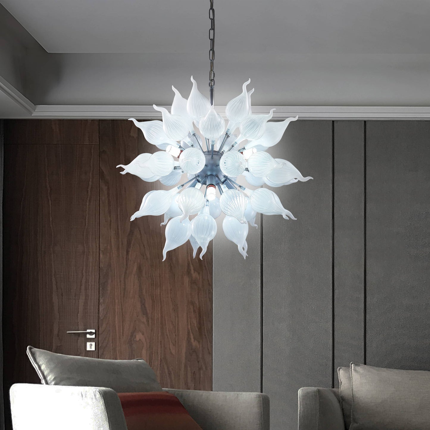 Arctic Frost chandelier illuminating a high-end living room with dark wood accents and modern art decor.