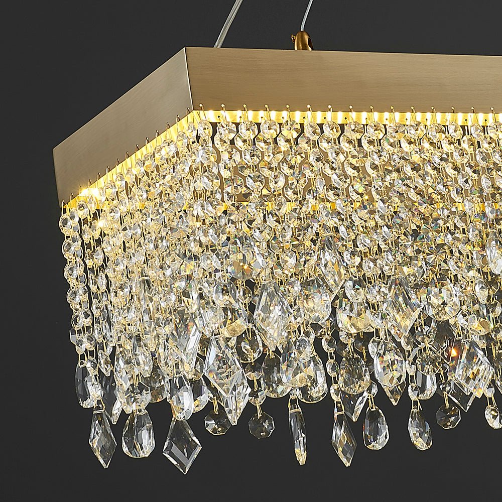 Close-up of high-quality luxury crystal droplets on a matte gold linear frame.
