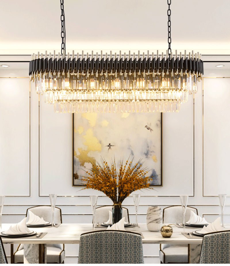 Artistic linear crystal lighting fixture for modern dining room or kitchen island decor.