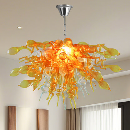 Close-up detail of hand blown golden and clear art glass chandelier.