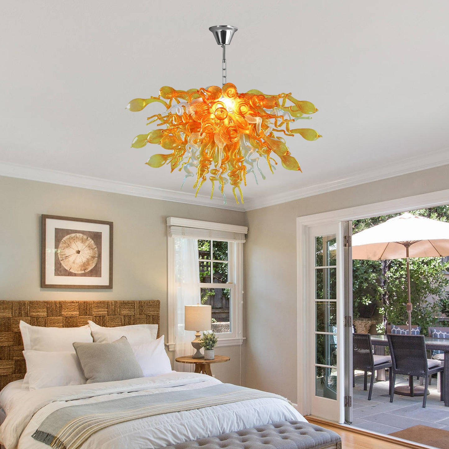 Hand blown art glass chandelier hanging in a contemporary bedroom.