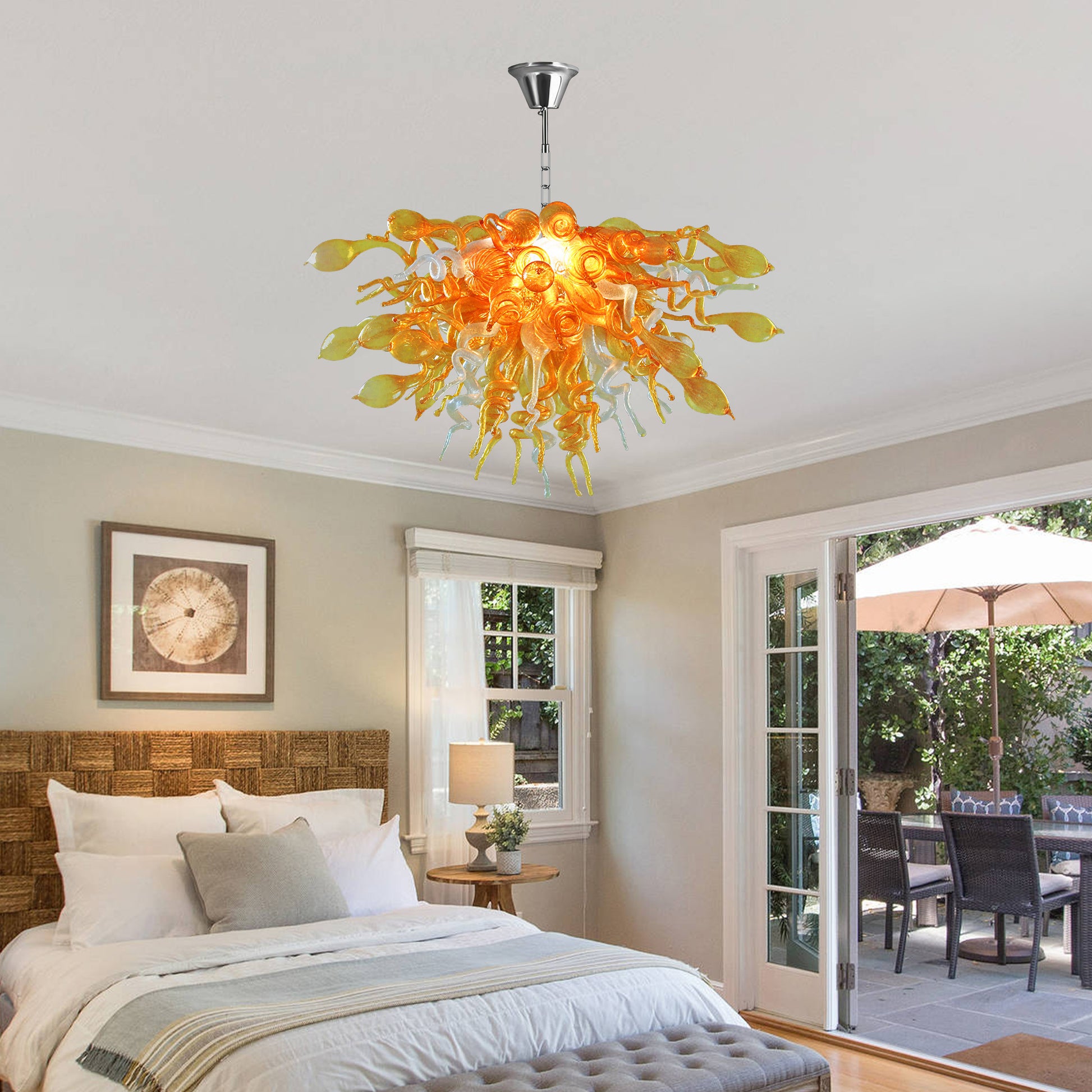 Hand blown art glass chandelier hanging in a contemporary bedroom.