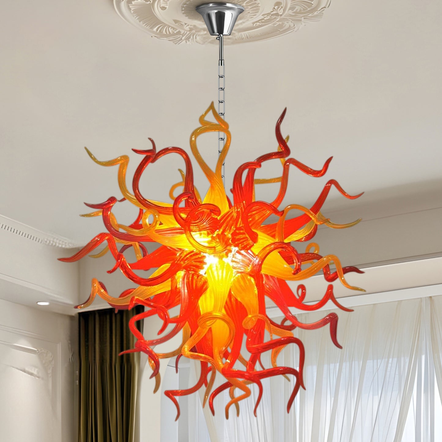 Fiery Chihuly-style hand blown art glass chandelier in bright space.