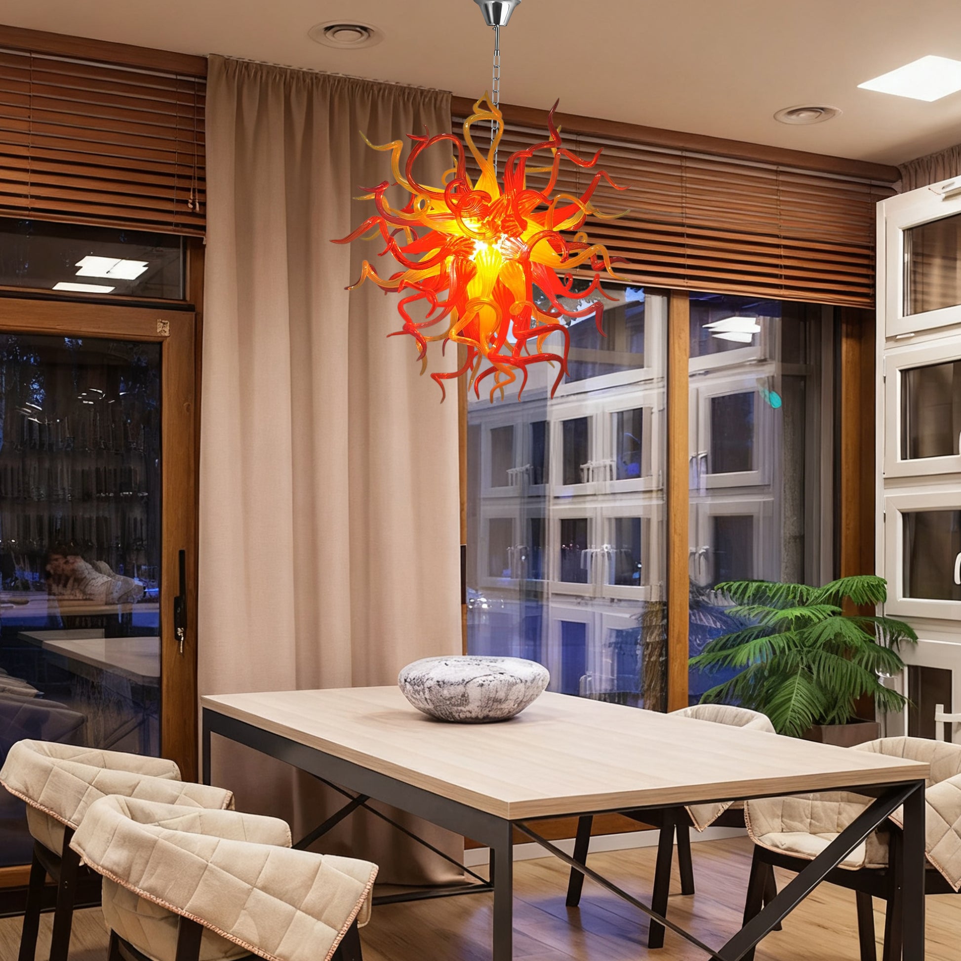 Chihuly-style red-orange hand blown glass chandelier in contemporary dining room.