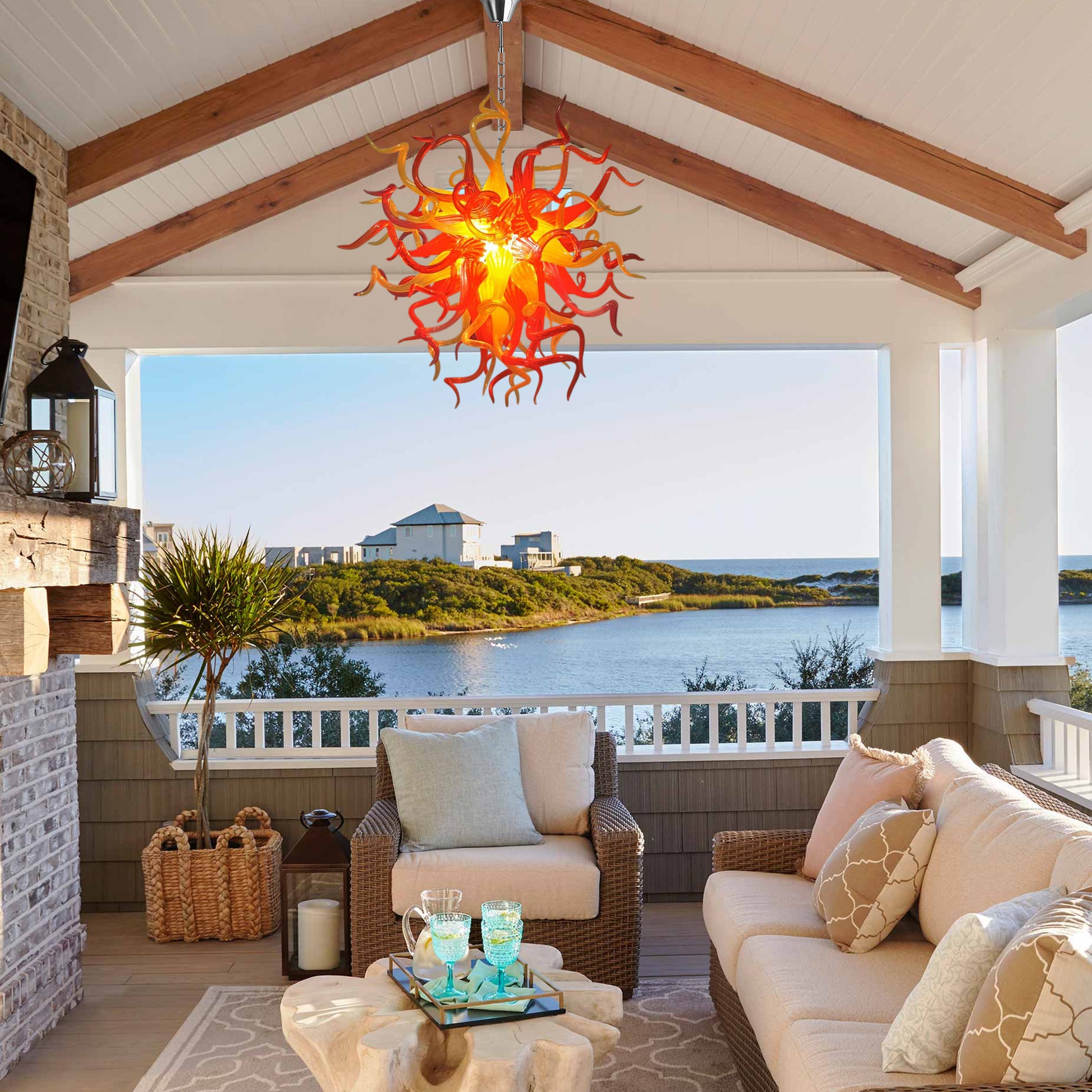 Blazing Sunset Chihuly style hand blown art glass chandelier in a Mediterranean-style living room.