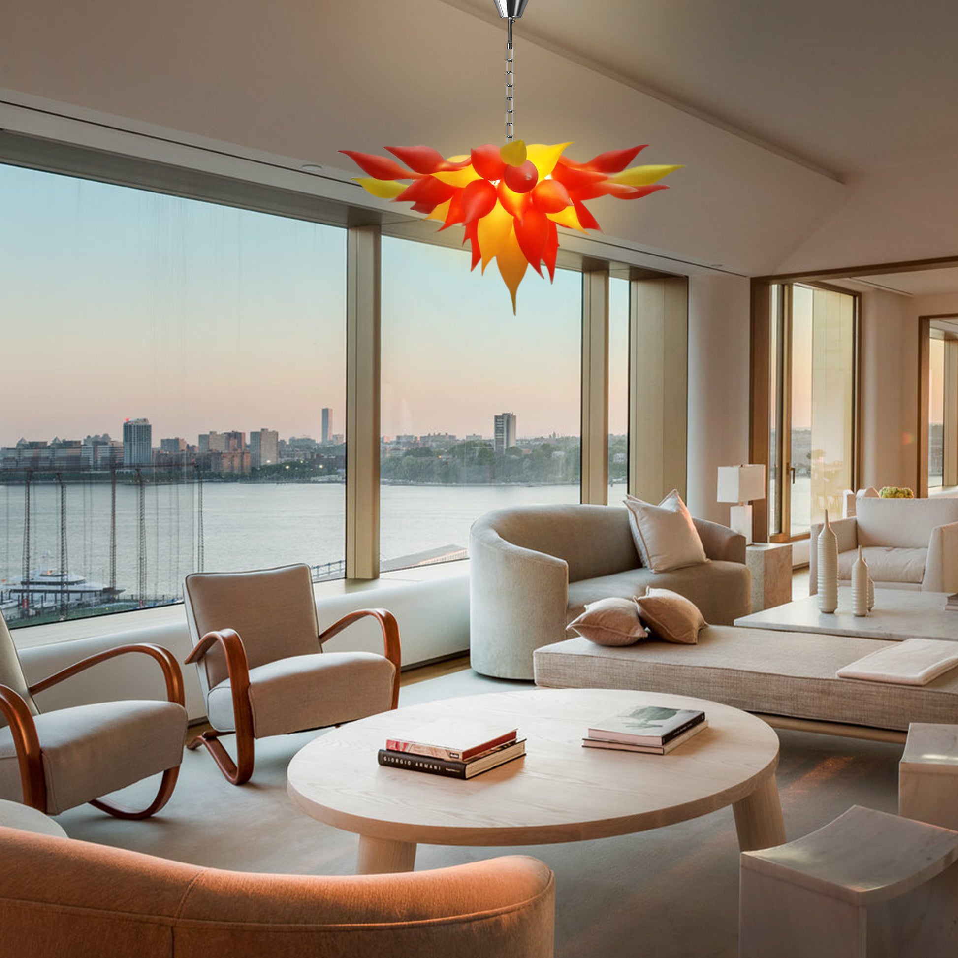 Vibrant red-orange floral blown glass pendant light in city waterfront living room.
