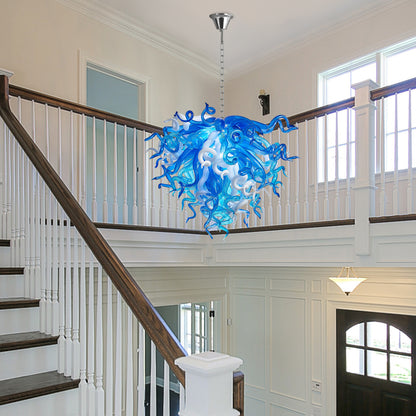 Modern blue and white murano blown art glass chandelier in two-story foyer.