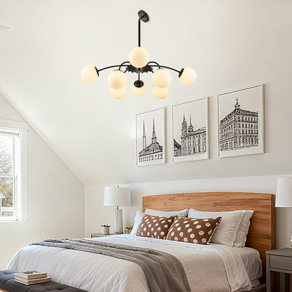 Black 8-light frosted glass pendant bubble ball chandelier in modern attic bedroom.