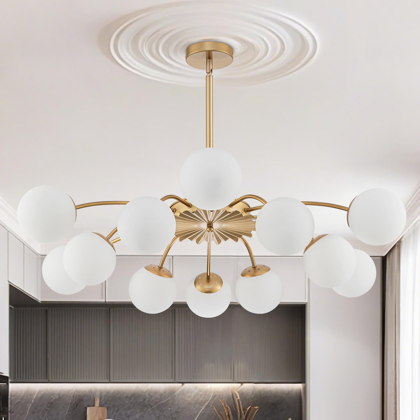  Brightly lit 12-light gold rod Chandelier with frosted opal glass globes, showcasing the adjustable hanging style.