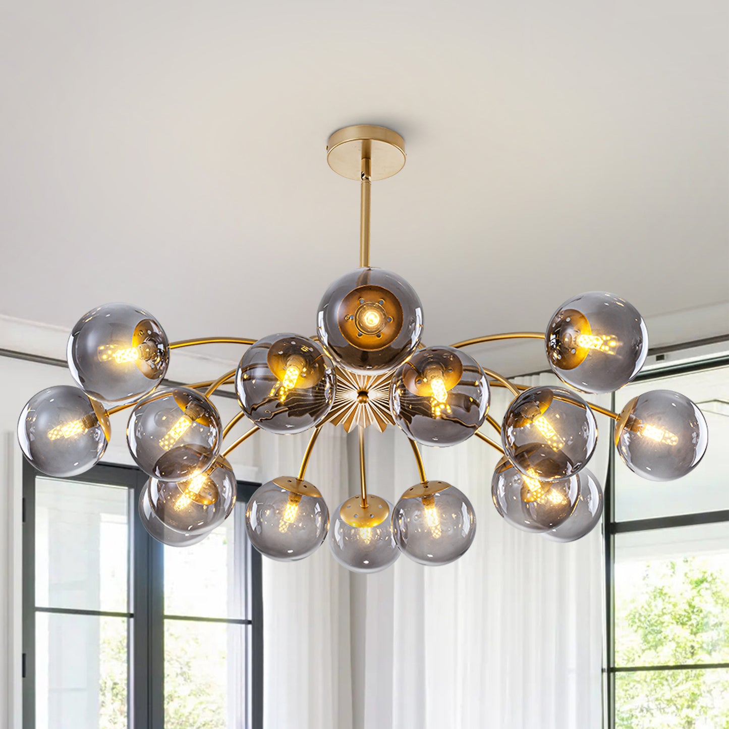 16-Light modern chandelier with smoky gray glass globes in a contemporary living room.