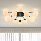 12-Light black ball semi-flush mount ceiling light in modern living room with clear curtains.