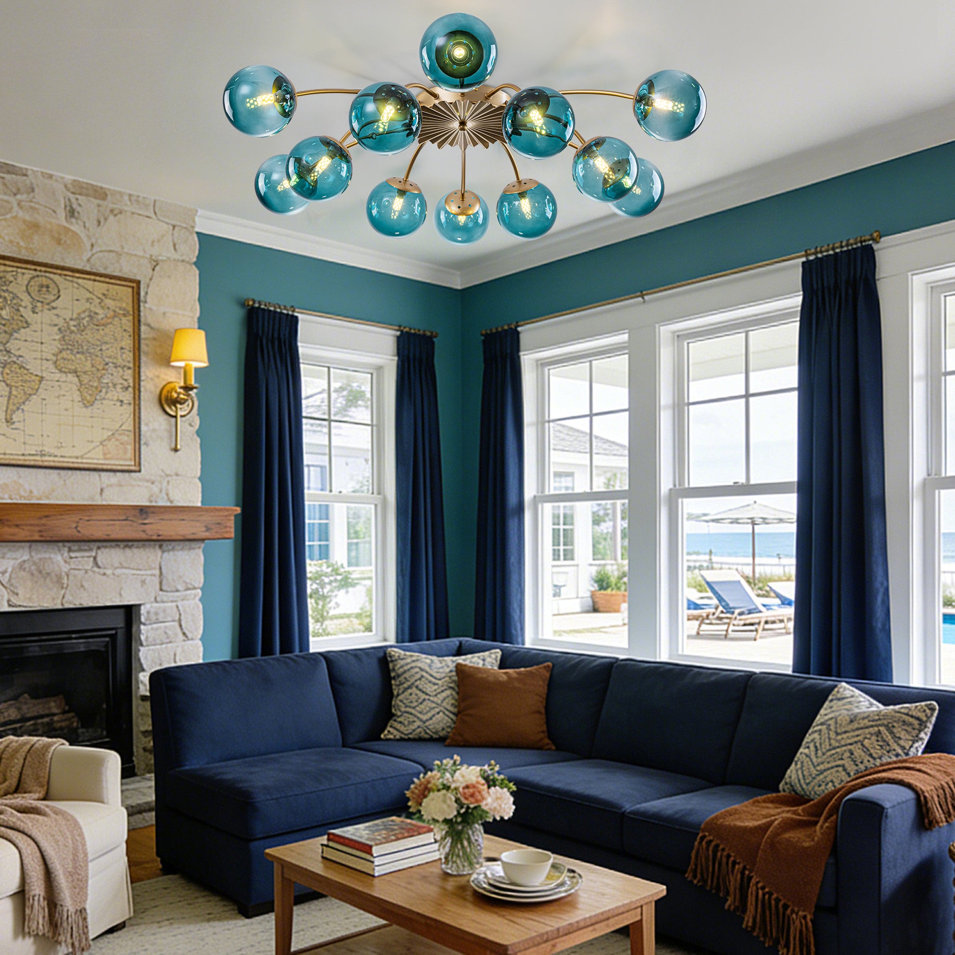 12-Light teal glass bubble globe ceiling light in coastal-style living room with navy sofa and ocean view.