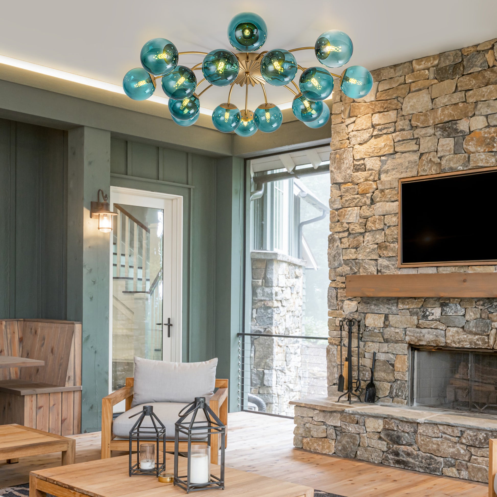 16-Light teal glass bubble globe semi-flush mount ceiling light in rustic living room with stone fireplace.