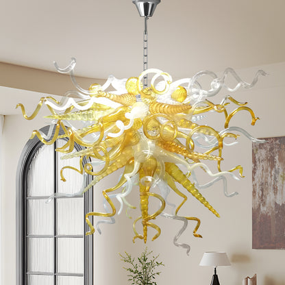 Amber and clear blown murano glass chandelier hanging a modern high-ceiling.