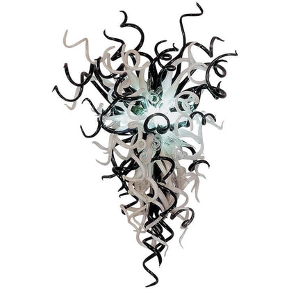 Monochrome Noir & Pearl artisan glass chandelier featuring a dramatic upward cluster of black, white, and clear hand-blown glass tendrils on a white background.