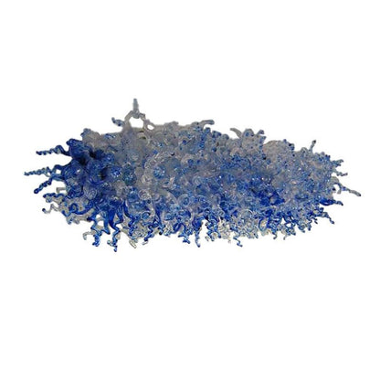 Close-up isolated view of the hand-blown blue and clear glass curls, highlighting the fluid design and color transition.
