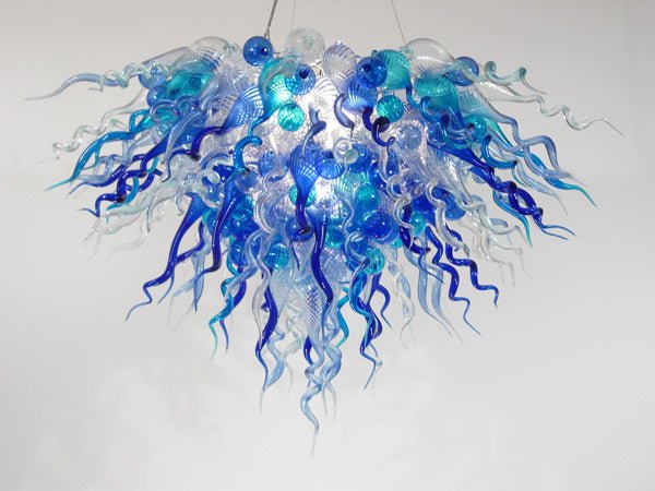 Arctic Horizon artisan chandelier with a dense cluster of sky blue and clear hand-blown glass tendrils and orbs.