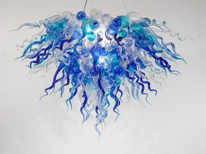 Arctic Horizon artisan chandelier with a dense cluster of sky blue and clear hand-blown glass tendrils and orbs.