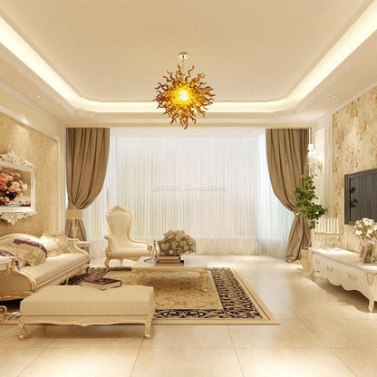 Elegant luxury living room with neutral tones, featuring a golden sunburst glass chandelier as a warm and radiant central ceiling focal point