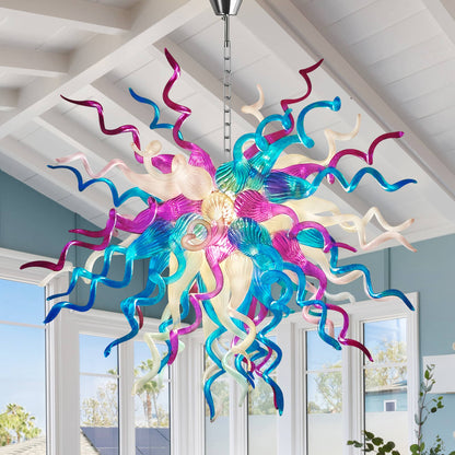 Hand-blown glass chandelier in pink, blue, and white, suspended from ceiling
