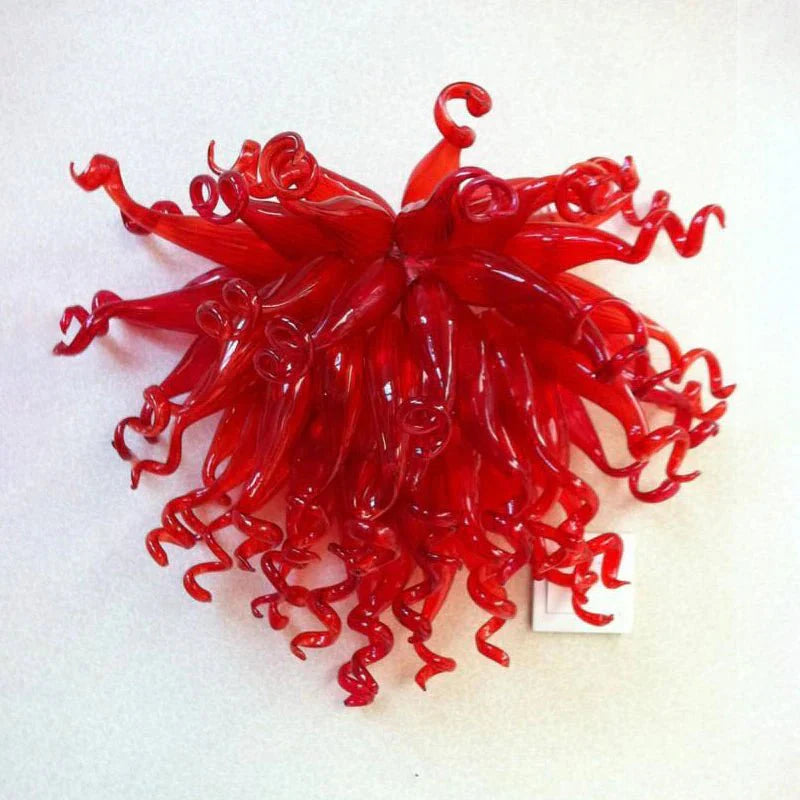 Vivid ruby red hand-blown glass wall light, perfect for adding passion and focal color to a room